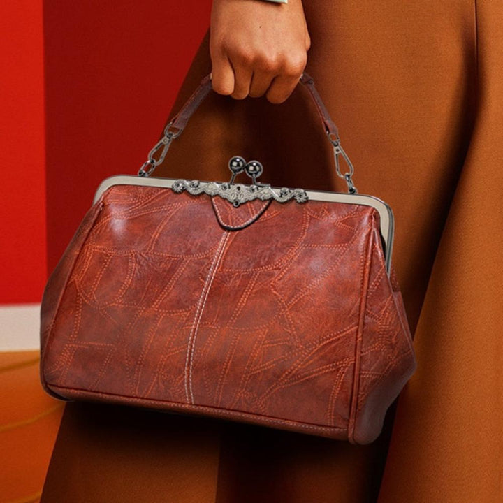 Bolso vintage de mano con cierre de clic